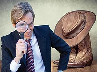 man with magnifying glass