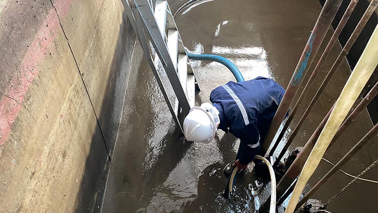 water being removed from a flooded building