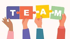 hands holding letters to spell out "team"