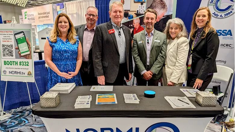 ISSA CleanFax Team with NORMI at Trade Show