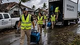 Restoration business deployed for hurricane response work Restoration crews deploy into a hurricane-damaged neighborhood, unloading equipment and preparing emergency response operations as recovery efforts begin after the storm