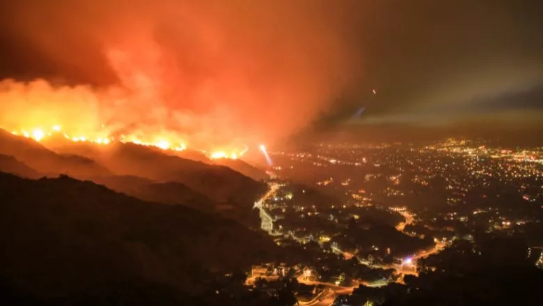 Rescue teams evacuating neighborhood from wildfire