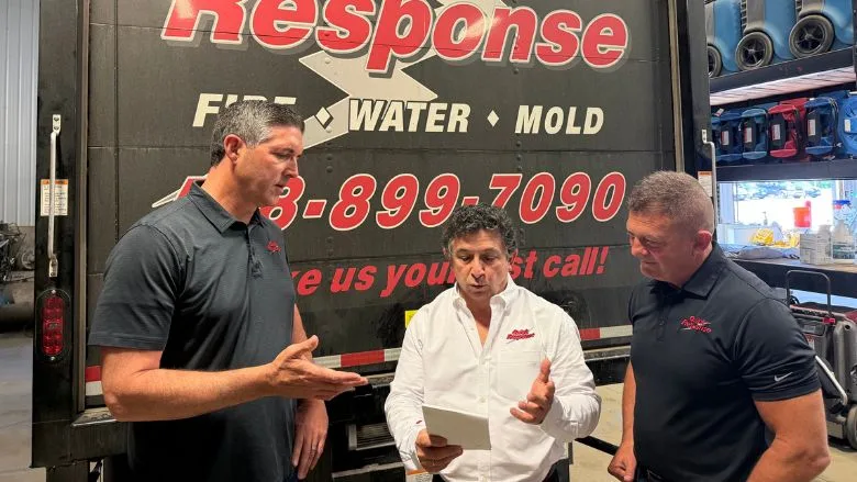 Quick Response Leadership in front of Quick Response Box Truck