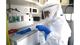 Microbial Warrior 2.0 Lori Jones in PPE with PAPR