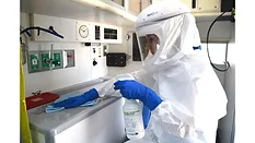 Microbial Warrior 2.0 Lori Jones in PPE with PAPR