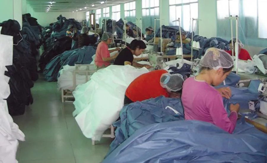 William “Dean” Kirk inspects some of the suits as they’re being made.