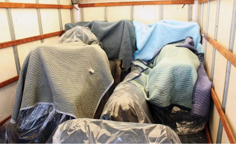 Properly padded and packed furniture moving truck, complete with tie-down bars.