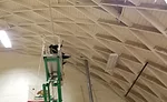 Cleaning the gym ceiling.