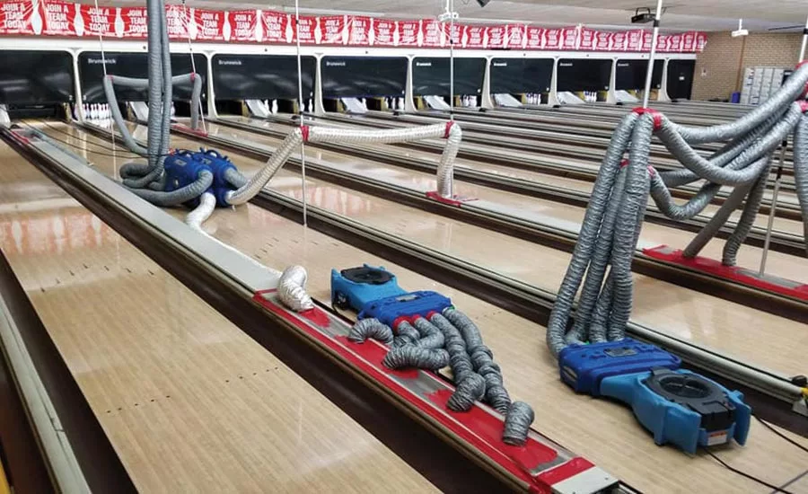 Target drying of a subfloor space using heat systems