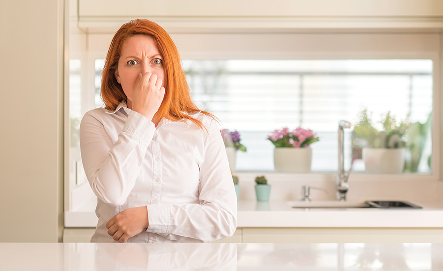 woman smelling something that smells