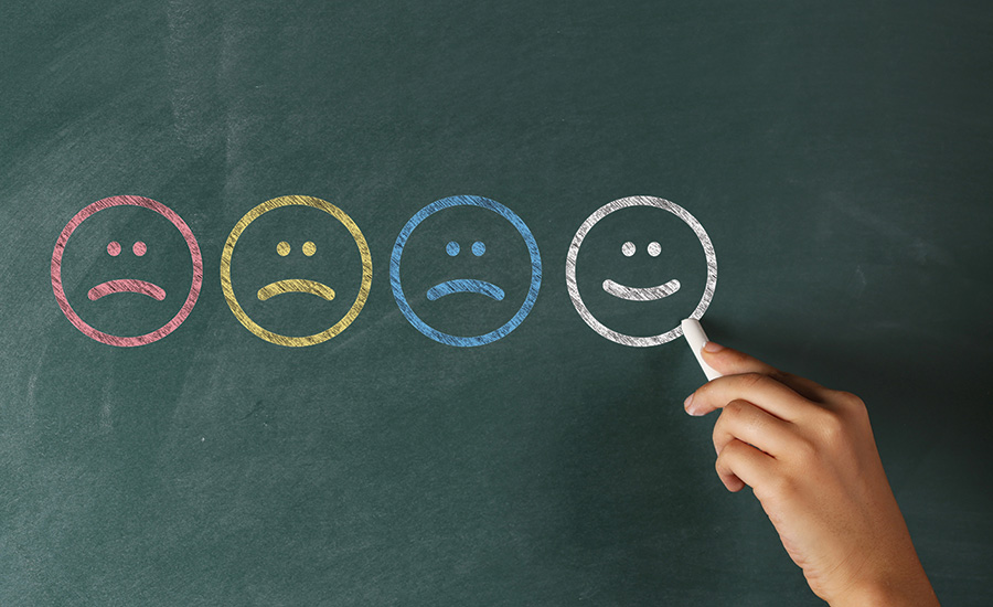 smiley faces on a chalkboard