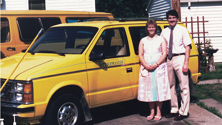 Amanda Stichter's parents in front of the company vehicle