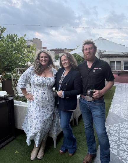 Meredith with coworkers at an outdoor gathering