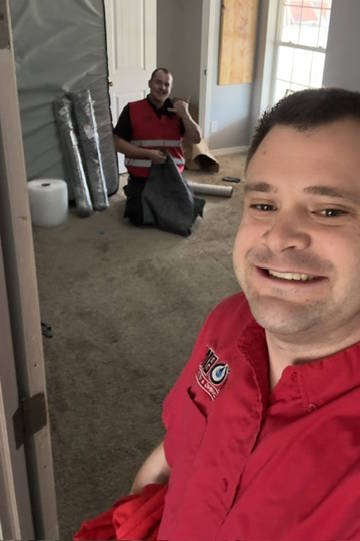 Nate Judy with a fellow restoration technician