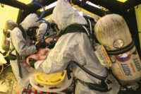 bio recovery workers in masks