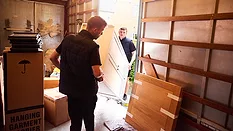 Loading furniture into removal truck