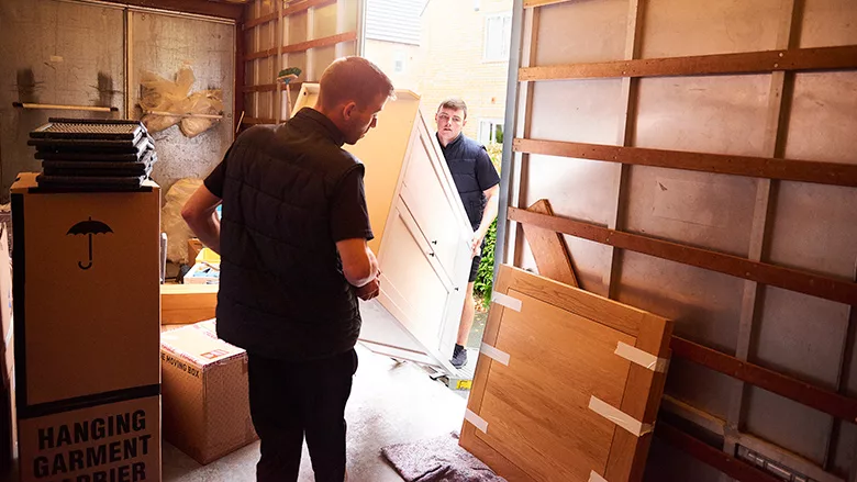 Loading furniture into removal truck