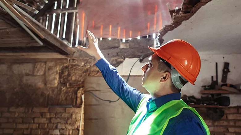 Inspector inside a fire damaged building