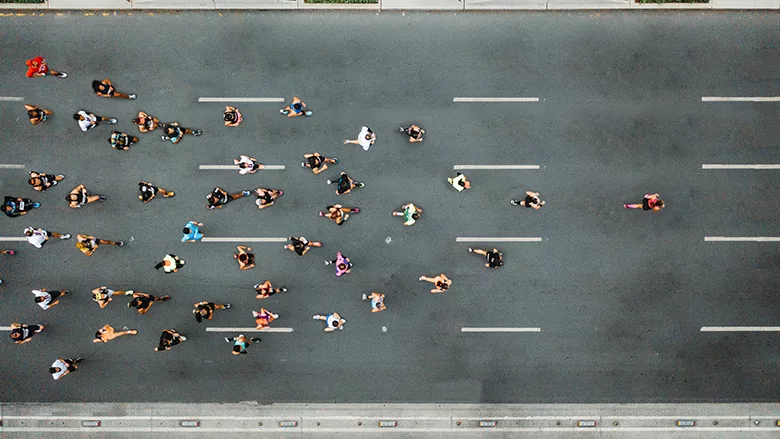 Aerial view of marathon city runners. 