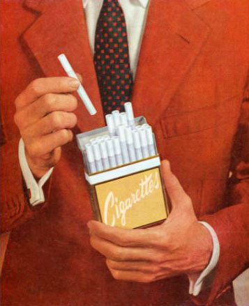 Man holding a pack of cigarettes
