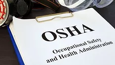 Pile of Documents with Occupational Safety and Health Administration OSHA