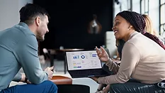 business team reviewing data on laptop