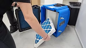 Employee examining HEPA Filter