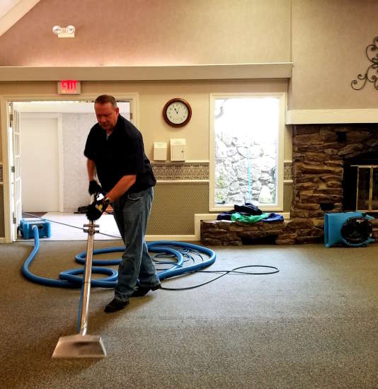Darren cleaning carpet