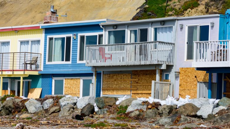 Beachfront houses at Rio Del Mar Beach strewn with storm debris