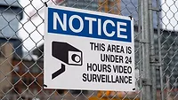 Notice of 24-hour surveillance on construction site fence Notice of 24-hour surveillance on construction site fence
