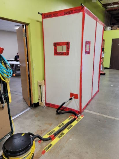 two-stage decontamination chambers used as a mini-containment