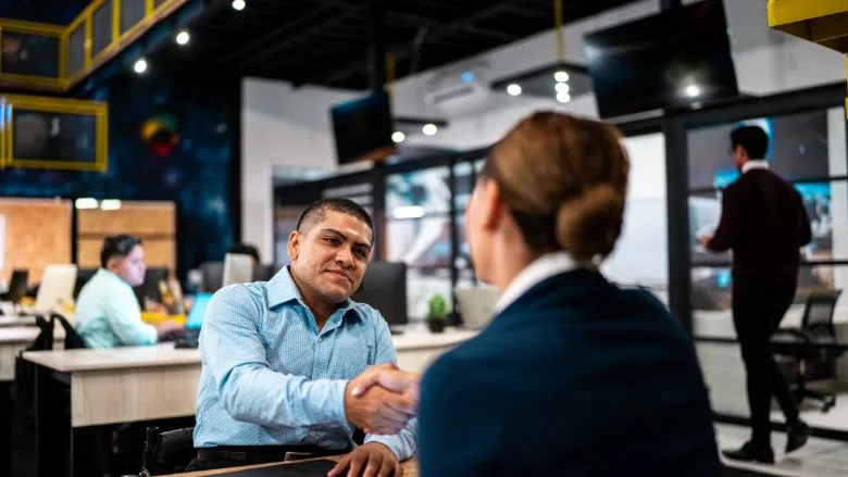Recruiter and candidate greeting each other during a job interview Recruiter and candidate greeting each other during a job interview