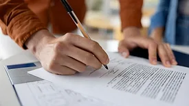 Man signing an agreement 