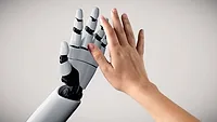 3D rendering of a robotic hand mirroring a human hand with their palms facing each other