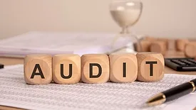 letter blocks that spell "audit"