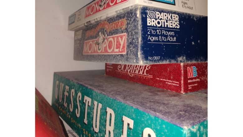Board games covered in mold in cabinet or closet